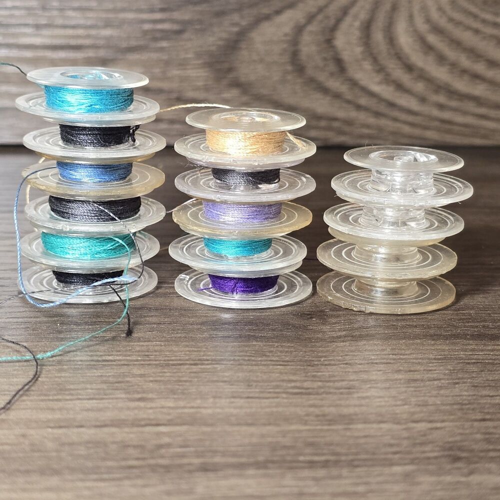 15 Sewing Machine Bobbins Made of Plastic, 11 With Thread, 4 No Thread